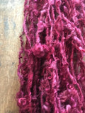 Merrily We Roll Along, burgundy curly 20 yards handspun yarn