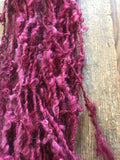 Merrily We Roll Along, burgundy curly 50 yards handspun yarn