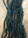 Evenrude 20 yards wavy sparkly forest green art yarn