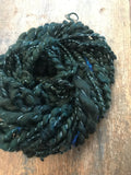 Evenrude 20 yards wavy sparkly forest green art yarn