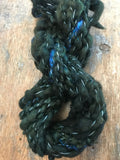 Evenrude 20 yards wavy sparkly forest green art yarn