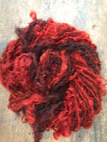 Blood Moon, orange/red overdyed Lincoln wool lockspun yarn, 20 yards