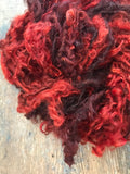 Blood Moon, orange/red overdyed Lincoln wool lockspun yarn, 20 yards