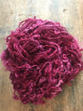 Merrily We Roll Along, burgundy curly 20 yards handspun yarn