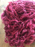 Merrily We Roll Along, burgundy curly 50 yards handspun yarn