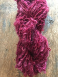 Merrily We Roll Along, burgundy curly 50 yards handspun yarn