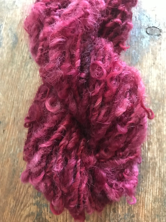 Merrily We Roll Along, burgundy curly 50 yards handspun yarn